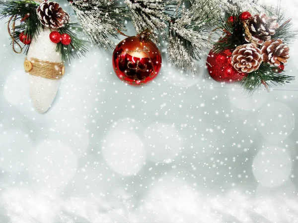 Christmas decor on fir tree branch with cones and snow on backgr — Stock Photo, Image