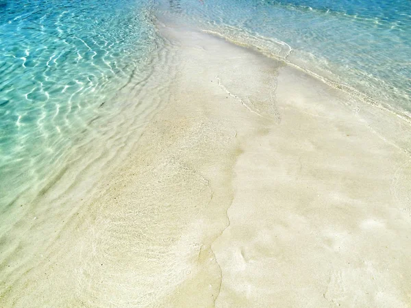 Voda textury písku pláže letní dovolená pozadí — Stock fotografie