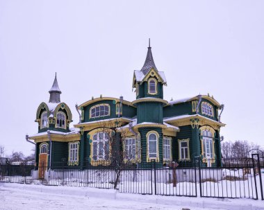 Gorokhovets, Russia - December 15, 2018: The amazing beauty of an old house in the style of Russian wooden Art Nouveau.  clipart