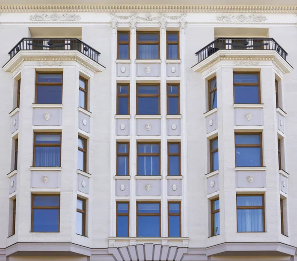 Vintage architecture classical facade with oriels in eclecticism
