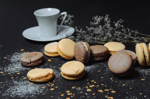 Coffee cup and colorful macaroons with lavender flowers