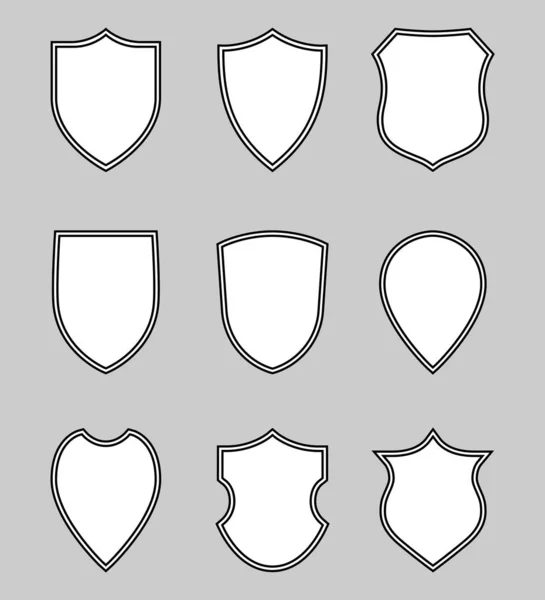 Nove escudos brancos — Vetor de Stock