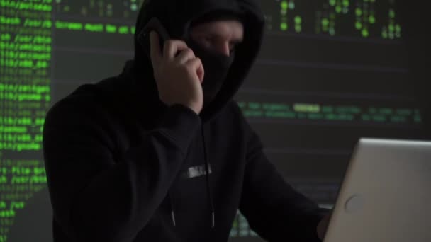 Hacker using mobile smartphone calling for victim — Stock Video