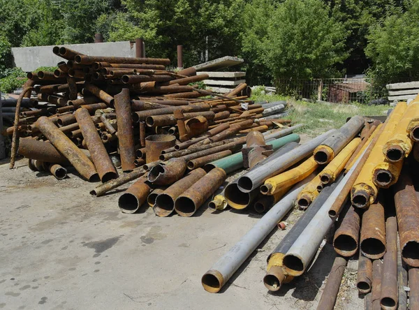 Dismantled old rusty pipes of large diameter, near new ready to install.