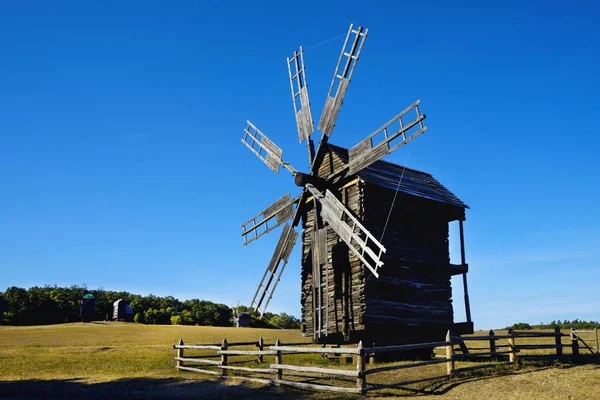 Old Ukrainian mill. Ukrainian mill of the XIX century. Autumn evening.   The village of Pirogovo. Wooden old mill.