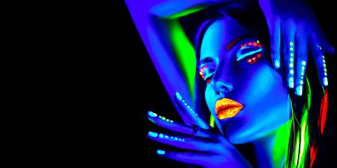 Fashion model woman in neon light. Portrait of woman with colorful fluorescent makeup. clipart