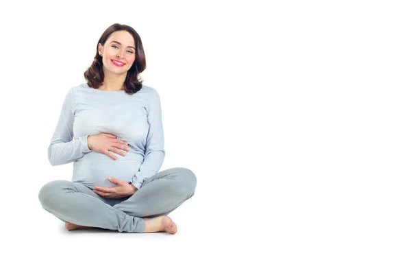 Těhotná žena jí sahala na břicho. Zdravý těhotenský koncept. Pr — Stock fotografie
