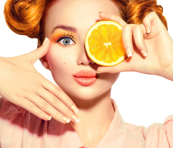 Beauty joyful teenage girl takes juicy oranges. Teen model girl 