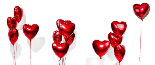 バレンタインデーだ気球のセット 白い背景に隔離された赤いハート形の箔風船の束 — ストック写真