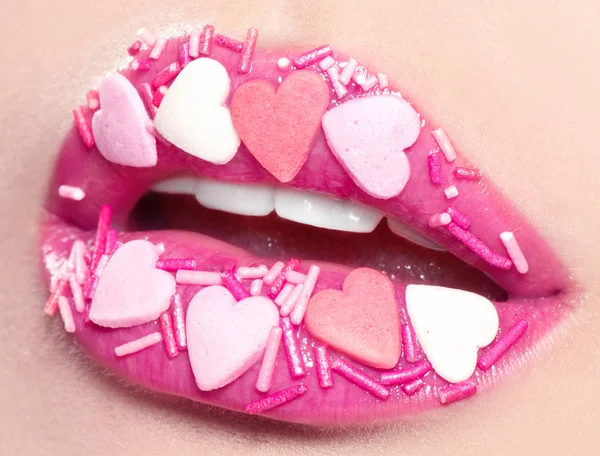 Valentine's Day makeup. Lips with pink hearts sugar sprinkles. V — Stock Photo, Image