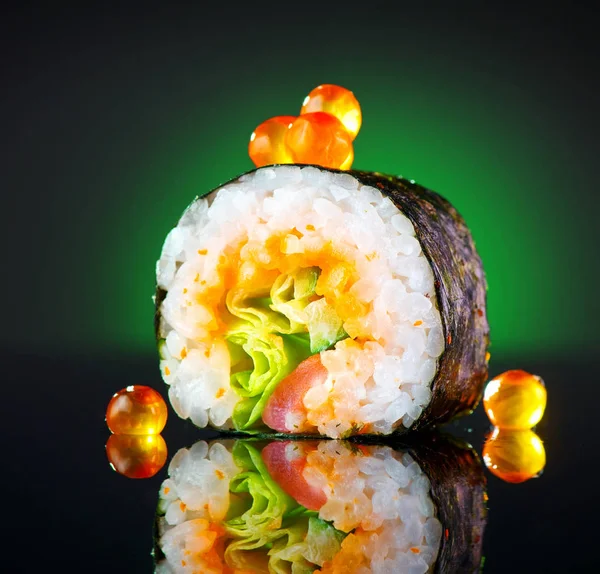 Sushi roll over black background. Sushi roll with tuna, vegetabl — Stock Photo, Image