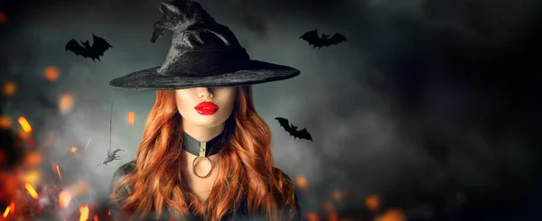 Halloween. Sexy witch portrait. Beautiful young woman in witches Stock Picture