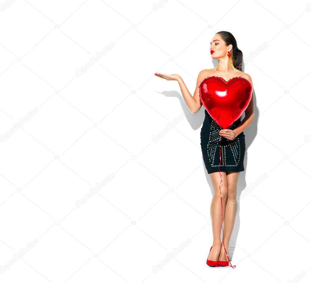 Valentine's Day. Beauty girl with red heart shaped air balloon, 