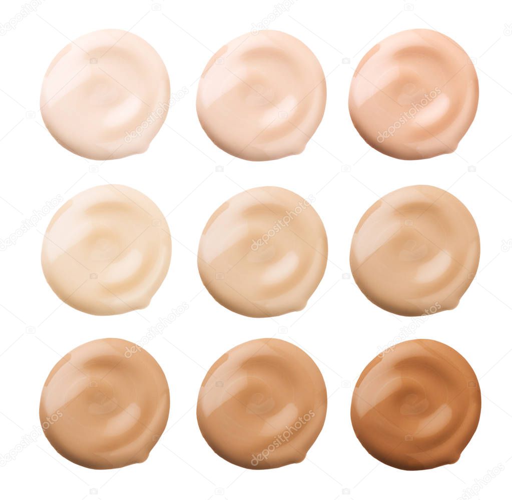 Foundation face makeup samples. Set of cosmetic liquid foundation or cream in different colour smudge smear strokes. Make up smears isolated on a white background. Foundation colors palette