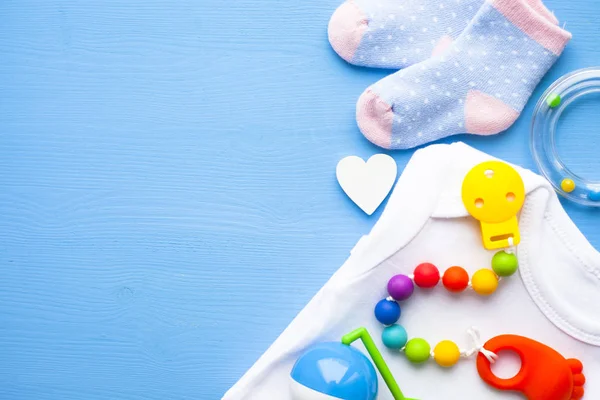 Baby Yellow Booties Children Shoes Toys Blue Background Newborn Top — Stock Photo, Image