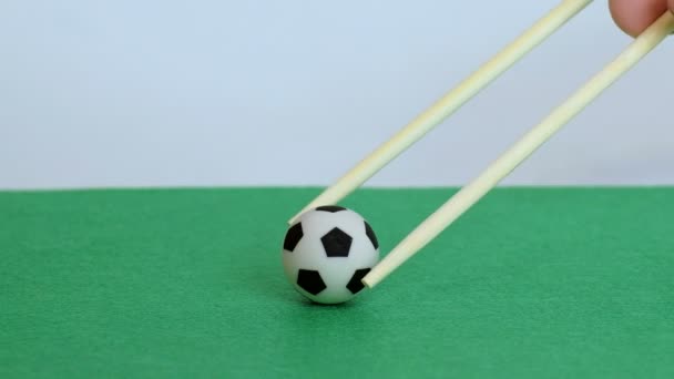 Male Hand Close Chopsticks Chinese Japanese Food Raises Lowers Soccer — Stock Video