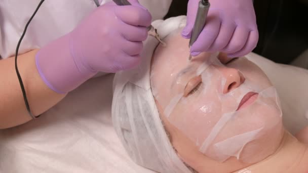 Cosmetic Procedure Facial Massage Using Electric Apparatus Woman White Mask — Stock Video