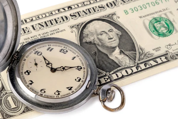 Advertising watchmaking. Close-up of an old pocket watch with scratches lie on a one-dollar bill of the USA with a portrait of Washington. The concept of time is money and effective time management.