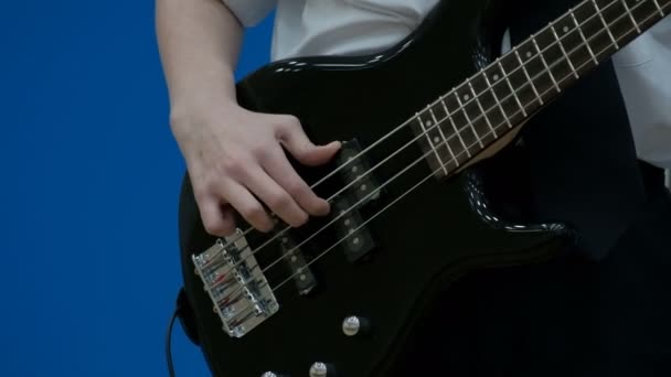 Guy Teen Bass Guitarist Playing Black Electric Guitar Close Fingers — Stock Video