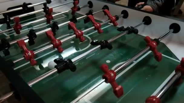 Table soccer. Invisible playing table football. Unknown playing foosball. The table game players. The figures for the game of table football spinning — Stock Video