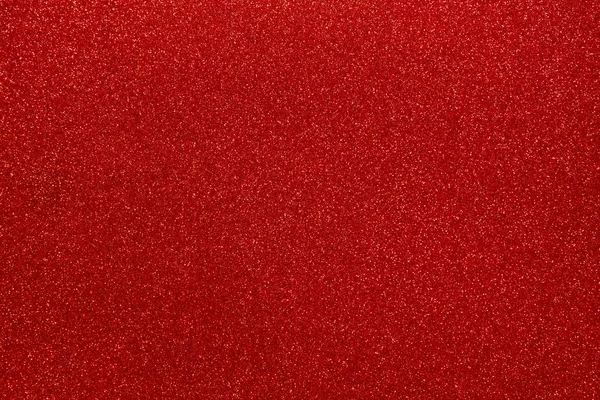Kırmızı parıltılar soyut parlak arka plan. Dekorasyon ve Noel, Yeni Yıl veya diğer tatil resimleri tasarımı için Scarlet tasarım kağıt doku. Güzel ambalaj malzemesi.