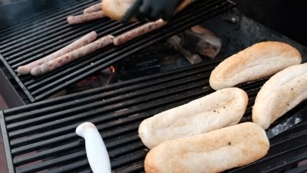 Street Chef Black Gloves Warms Bread Sausages Grill Close Cooking — Stock Video