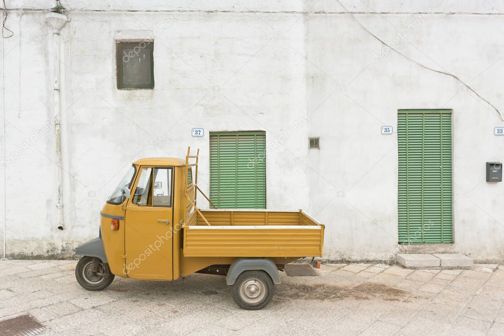 Specchia, Apulia, Italy - An old historic three wheeler in the streets of Specchia