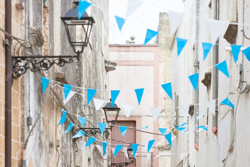 Presicce, Apulia, Italy - Blue and white bunting in the streets to celebrate