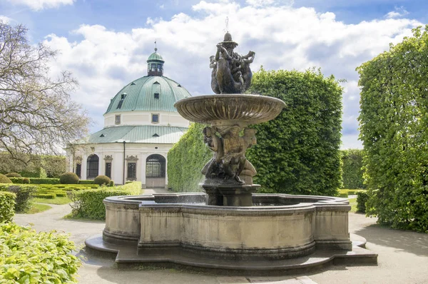 Flower gardens in french style, fountain and rotunda building in Kromeriz, Czech republic, Europe