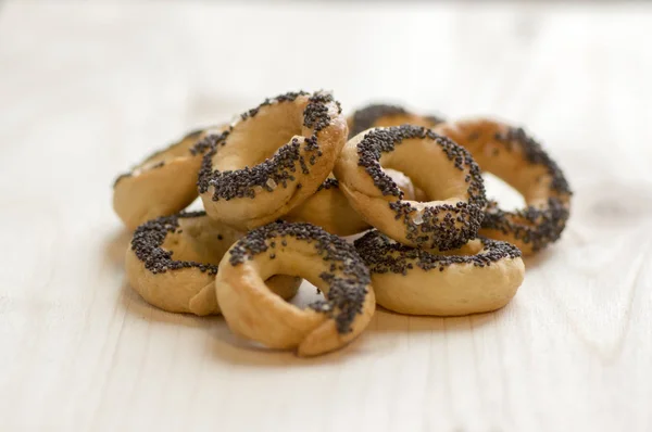 Baked Fresh Pretzels Wooden Table Circle Shapes Covered Poppy Seeds — Stock Photo, Image