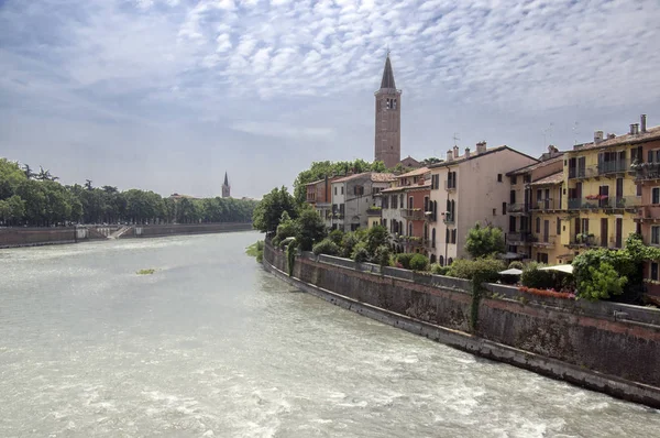 Adige river bank with historic buildings, Verona city in Italy, romantic town