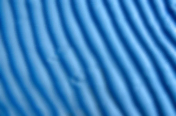 蓝色的沙子纹理 背景与浅蓝色细沙 沙地上的波浪的锐利线条 沙滩上的沙面 从上面看 沙地在户外的日出时间 几何图案 — 图库照片