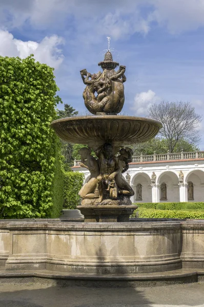 Flower gardens in french style, fountain, fountain and colonnade building in Kromeriz, Czech republic, Europe