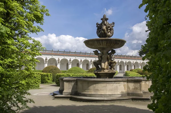 Flower gardens in french style, fountain, fountain and colonnade building in Kromeriz, Czech republic, Europe