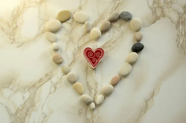Stone heart, stones in the shape of a heart, happy valentines day, simplicity, sunny, sunlight, grey and white pebbles, light and dark