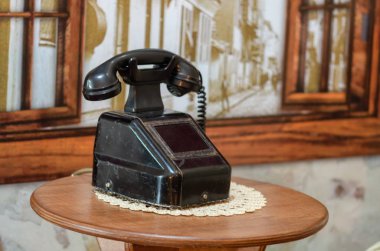 Vintage telephone over retro background clipart