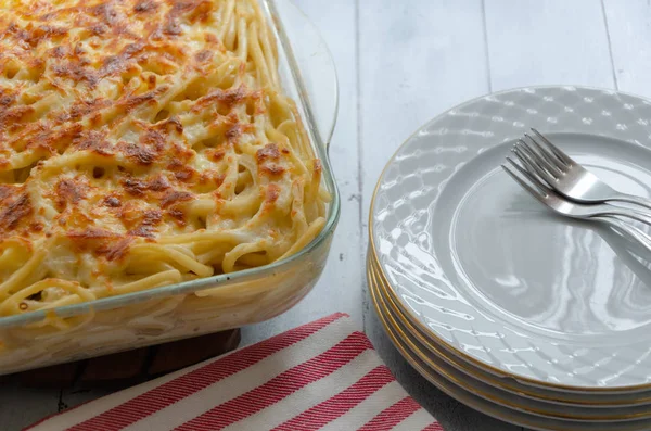 Baked pasta ready meal with spiral pasta, sauce  and cheese.