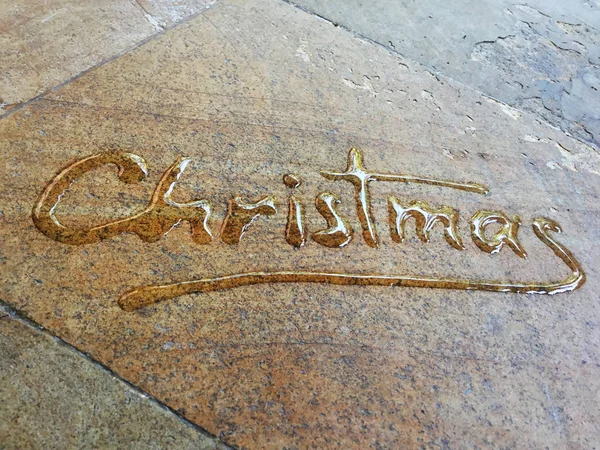 Christmas spontaneous water handwriting calligraphy. Artistic and natural photo good use for any design you want.