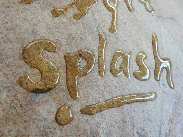 Splash spontaneous water handwriting calligraphy. Artistic and natural photo good use for any design you want.