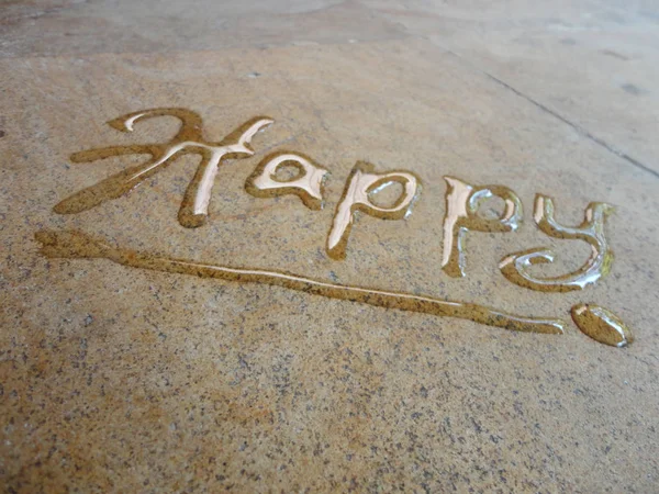 Happy spontaneous water handwriting calligraphy. Artistic and natural photo good use for any design you want.