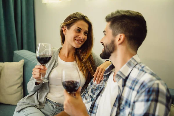 Portrait Smiling Young Couple Celebrating Anniversary Glasses Wine Home Couch — Stock Photo, Image
