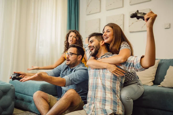 Someone must lose! Group of friends is having fun while playing video games.