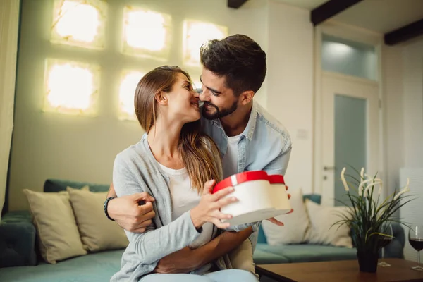 Young Woman Receiving Surprise Gift Box Her Boyfriend Home — Stock Photo, Image