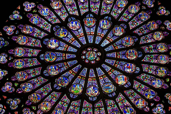 PARIS  FRANCE - JULY 17, 2018: The North Rose window at Notre Dame cathedral dates from 1250 and is also 12.9 meters in diameter. Its main theme is the Old Testament. — Stok fotoğraf