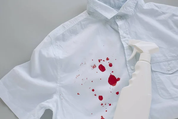blood stains on clothes and stain remover. High quality photo