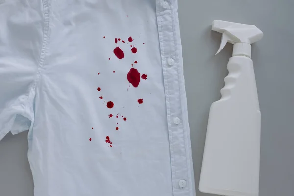 blood stains on clothes and stain remover. High quality photo