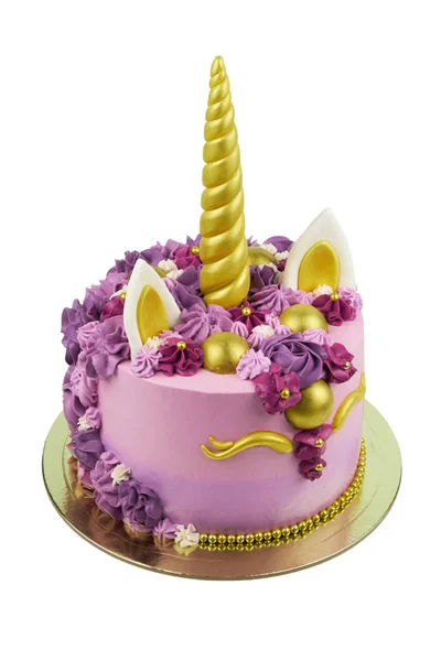 Cake unicorn isolated with pink cream and flowers for girl\'s birthday on white backgrounds.