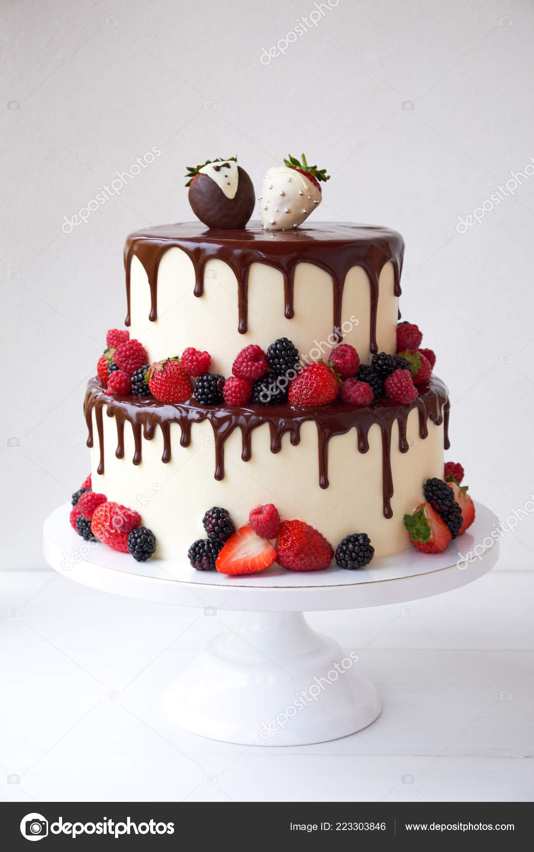 Two Tiered Wedding Cake Chocolate Slices Strawberries Raspberries