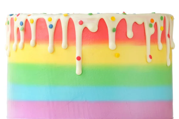 Cake blank with colorful rainbow cream on a white background decorated with colorful sprinkles, poured with chocolate. Simple minimalism. Isolated.