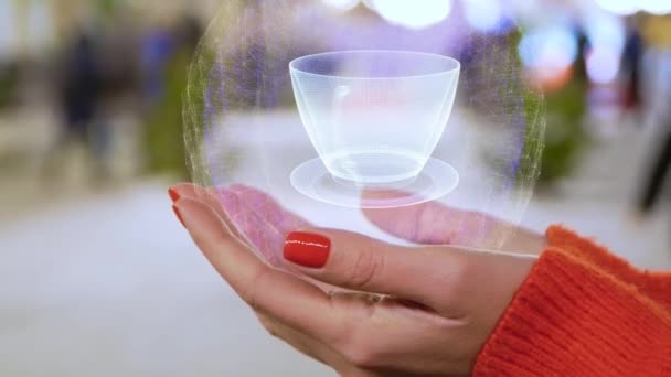 Manos femeninas sosteniendo un holograma conceptual con taza de café — Vídeos de Stock